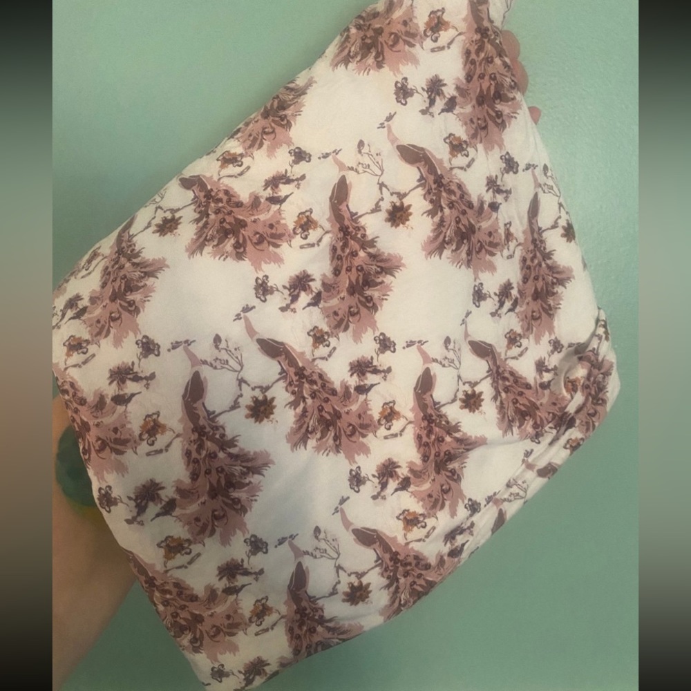 Kate Quinn peacock swaddle
